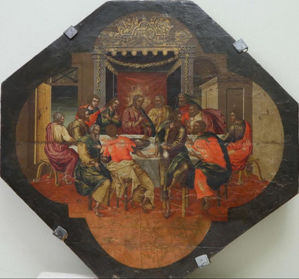 Доска: Икона без выемки, восьмиугольная.
Изображена сцена тайной вечери: вокруг стола сидят Христос (в центре) и 12 учеников. Христос сидит на троне. Поля темно-зеленые.